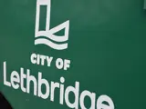 Green bin City Of Lethbridge logo close up