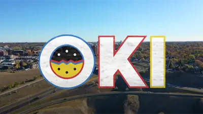 Oki logo over Landscape skyline