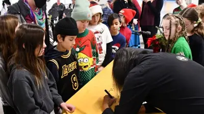 Winter Solstice signing autograph with children