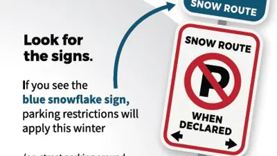 Look for the signs. blue snowflake sign, snow route sign