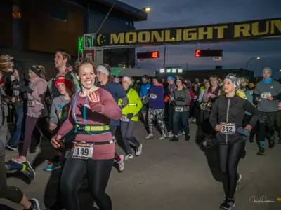 2023 Moonlight Run participants under banner