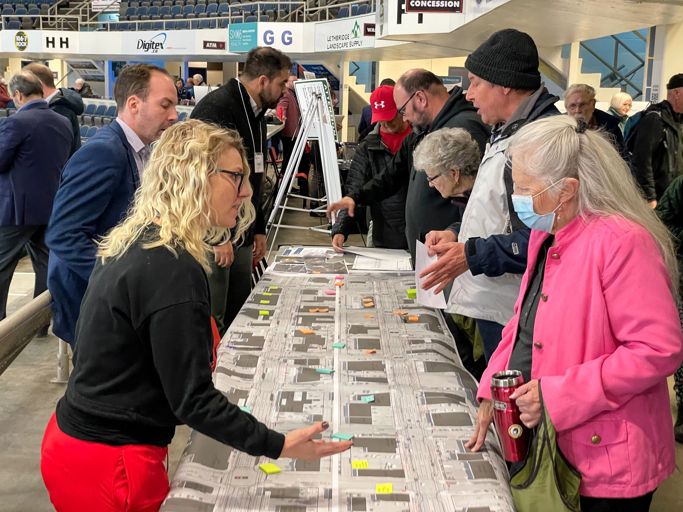 City staff talking with residents at an open house